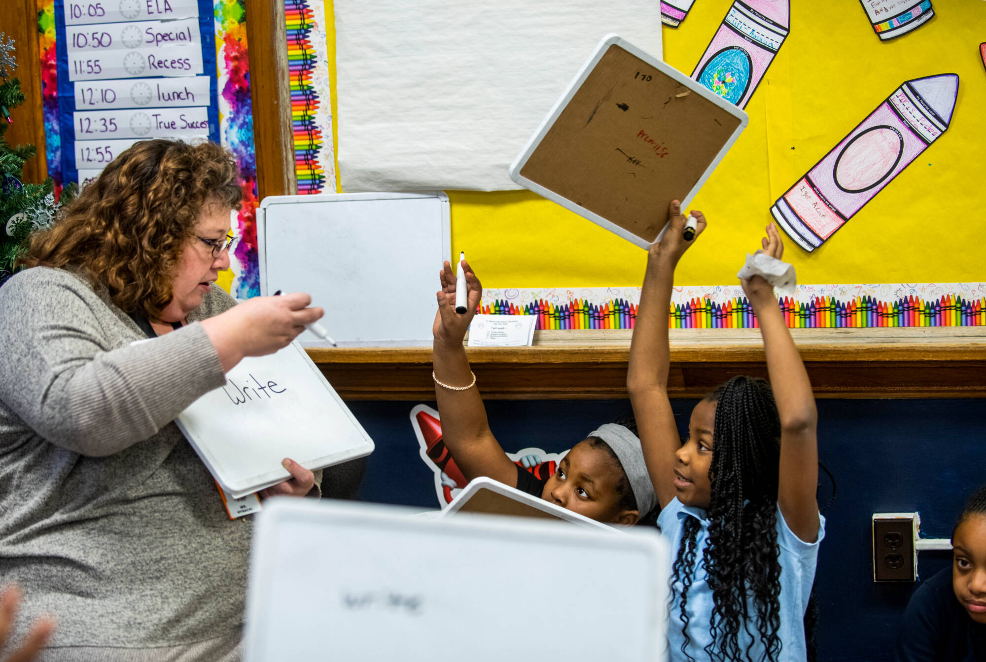 GVSU student teaching a vocabulary lesson with students using whiteboards.